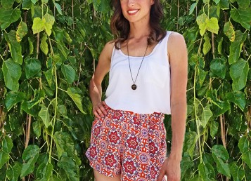 Goodwill Kansas News Article August 2017 Michelle Orange Shorts